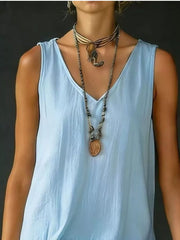 Light blue V-neck sleeveless dress with tiered ruffled hem detail.