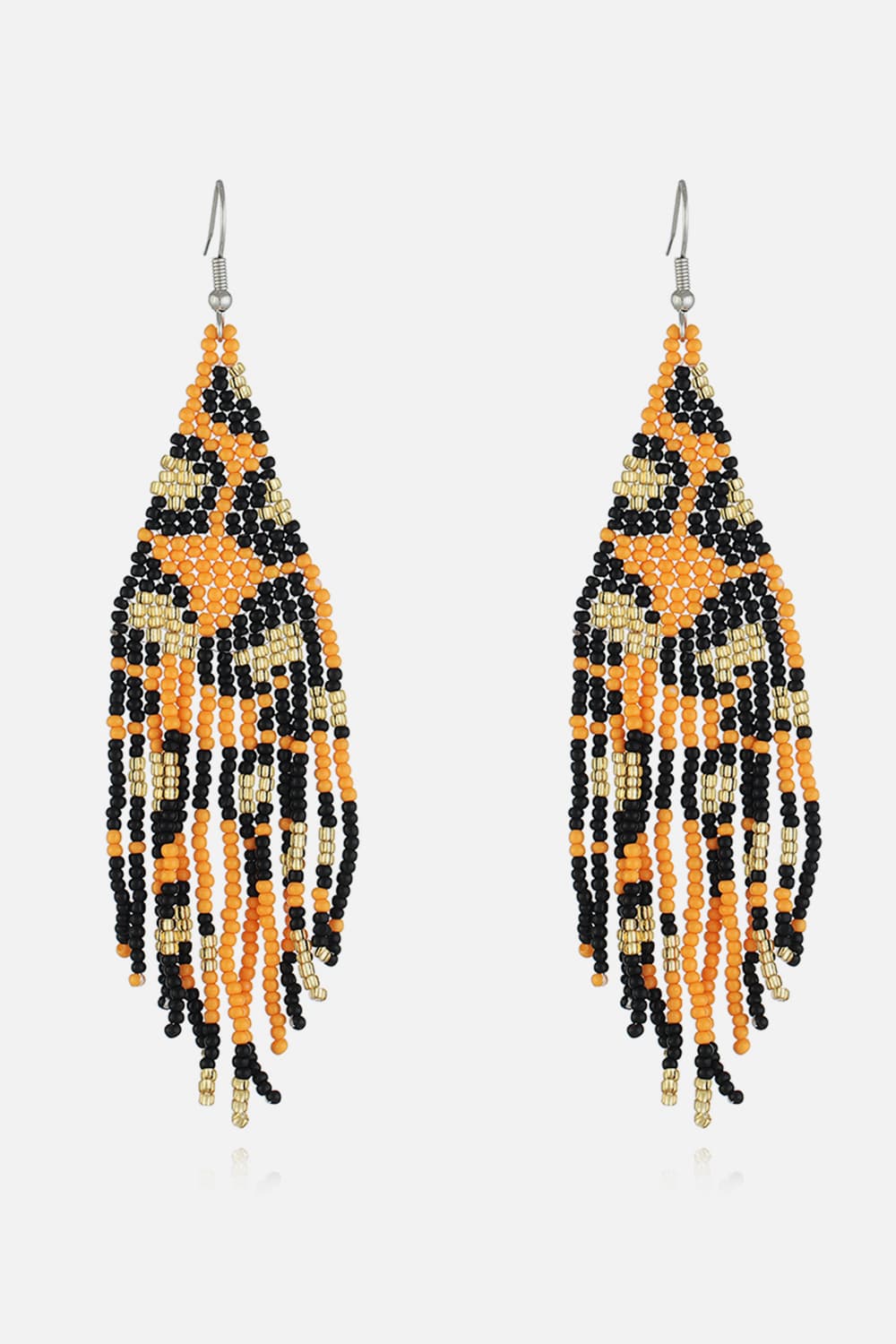Tangerine leopard bead fringe earrings with black and gold accents.