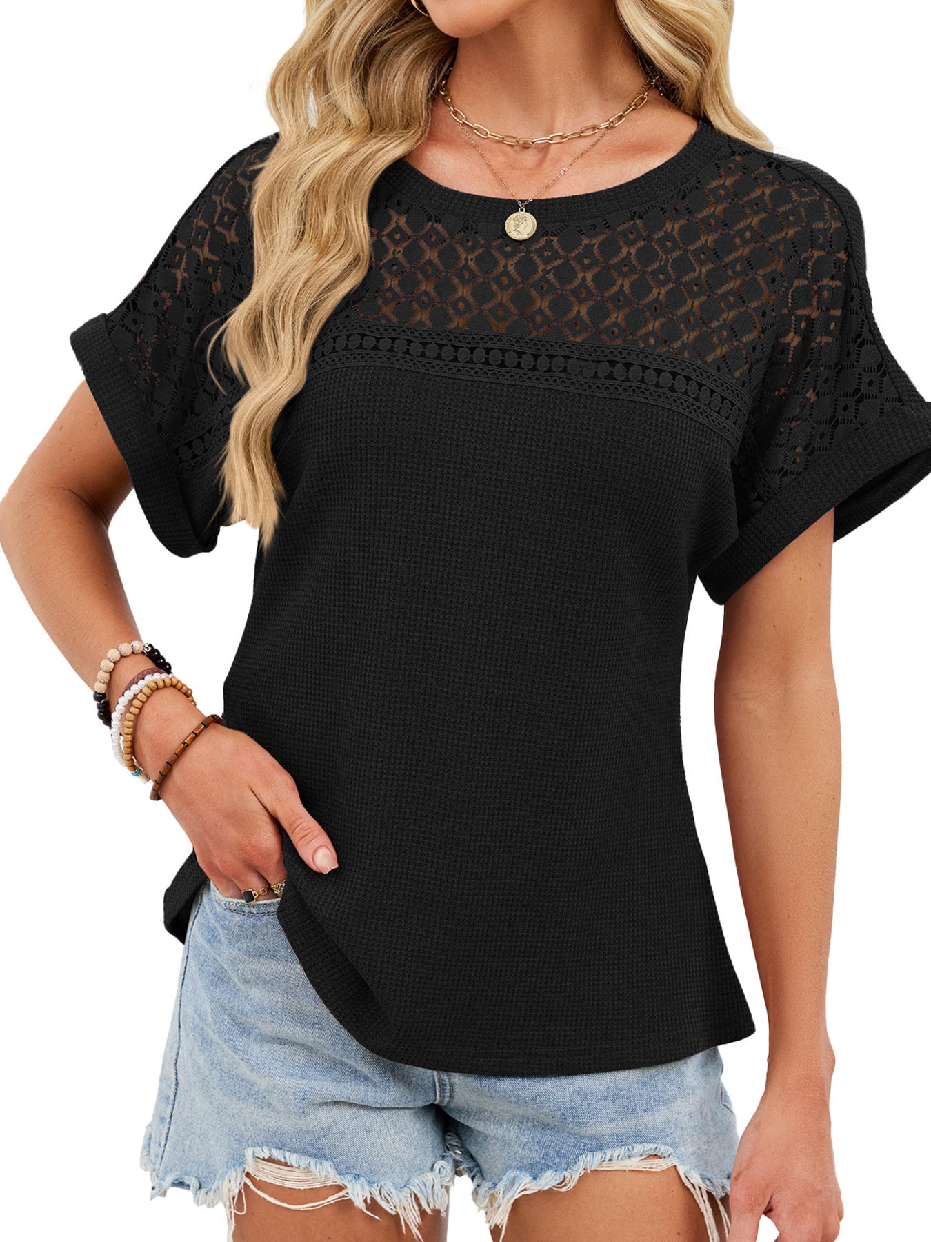 Black waffle knit t-shirt with eyelet lace yoke and sleeves.
