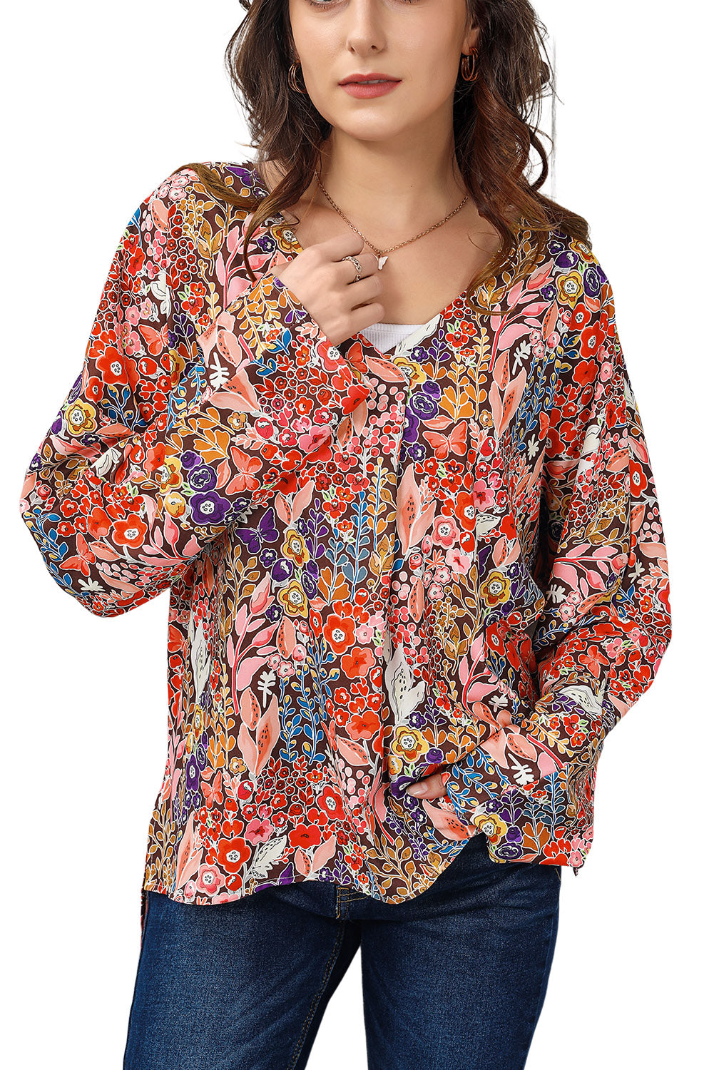 Painterly floral oversized blouse with flared sleeves and V-neck.