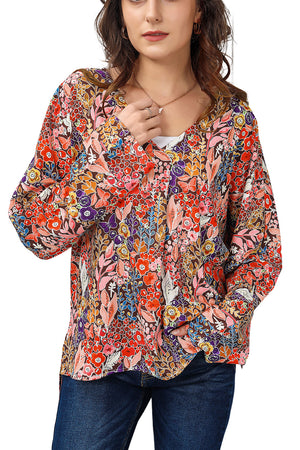 Painterly floral oversized blouse with flared sleeves and V-neck.