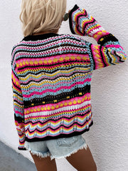 Rainbow chevron knit cardigan with open weave and bell sleeves.