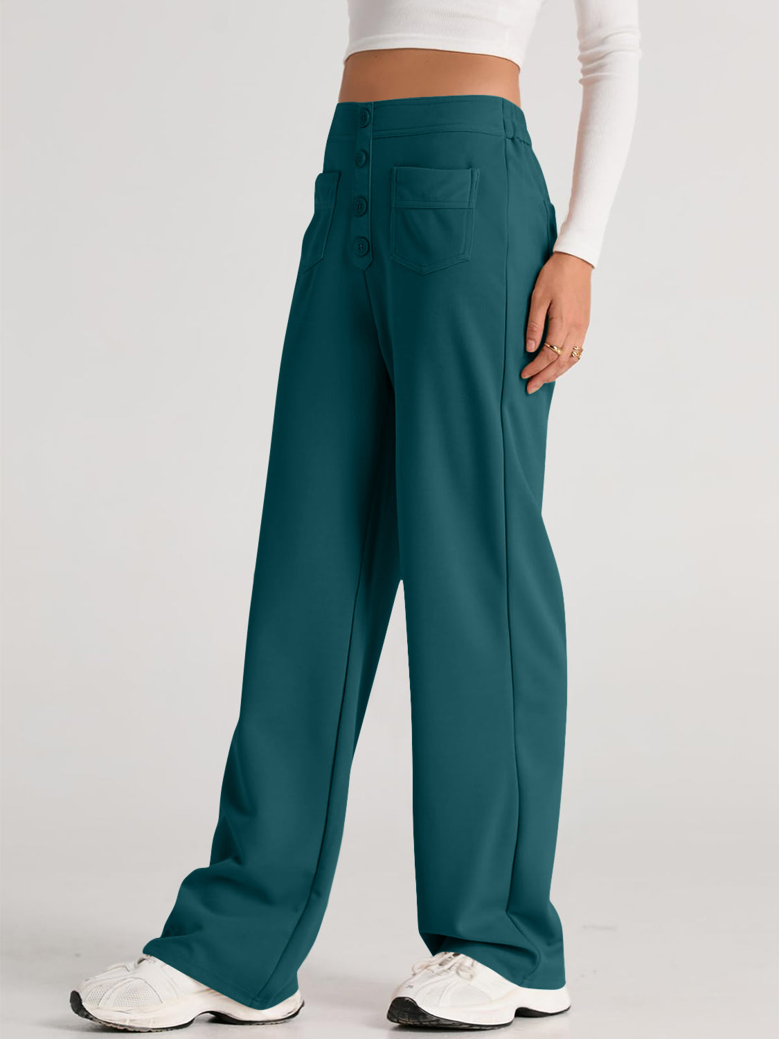Button-front wide leg trousers in deep teal with two front pockets and a high waist.