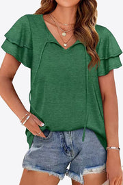Forest green blouse with tiered flutter sleeves and a keyhole neckline with ties.
