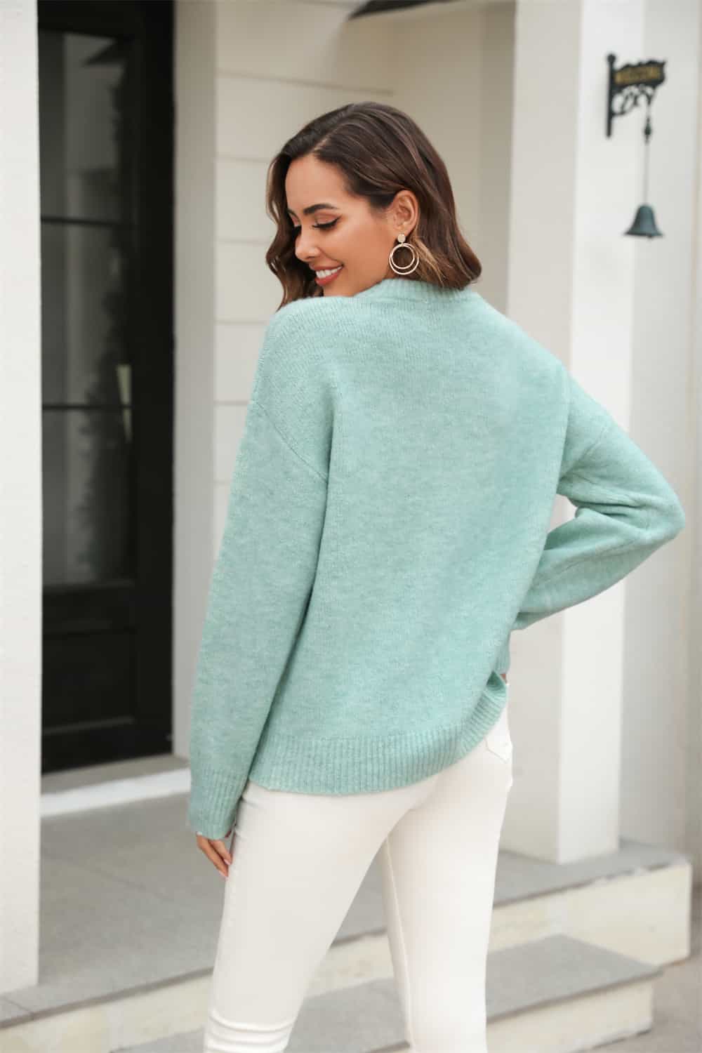 Light Green brushed-knit crewneck pullover sweater with ribbed cuffs and hem.
