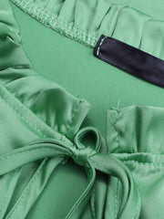 Gum Leaf green satin blouse with tie neck and shirred cuffs detail