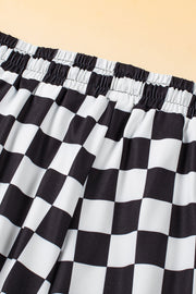 Black and white checkerboard lounge shorts with elastic waistband