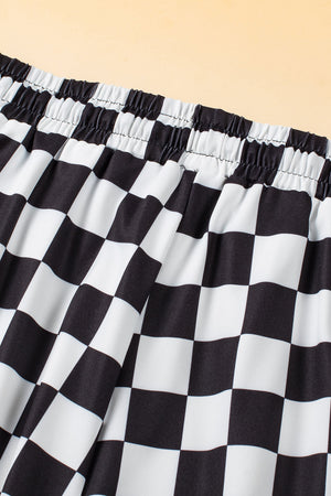 Black and white checkerboard lounge shorts with elastic waistband