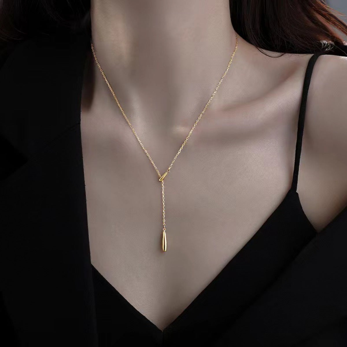 Gold Y-shaped pendant necklace in sterling silver with a delicate drop detail.