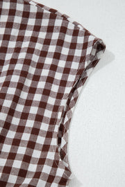 Gingham zip-front midi dress in taupe cotton, close-up of sleeve detail.