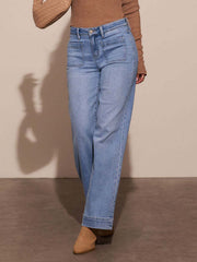 Sailor-inspired light wash denim jeans with wide legs and patch pockets.
