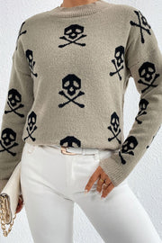 Cosmic Motif Mock Neck Knit sweater in Khaki with allover black skull and crossbones pattern.