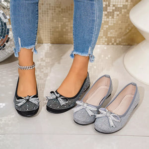 Rhinestone bow flats in black and gray, featuring a comfortable casual style.