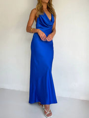 Blue satin asymmetric halter maxi gown with cowl neck and body skimming fit