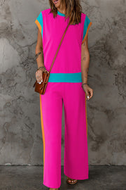 Colorblock sportswear set with contrast trim in hot pink, aqua, and orange.
