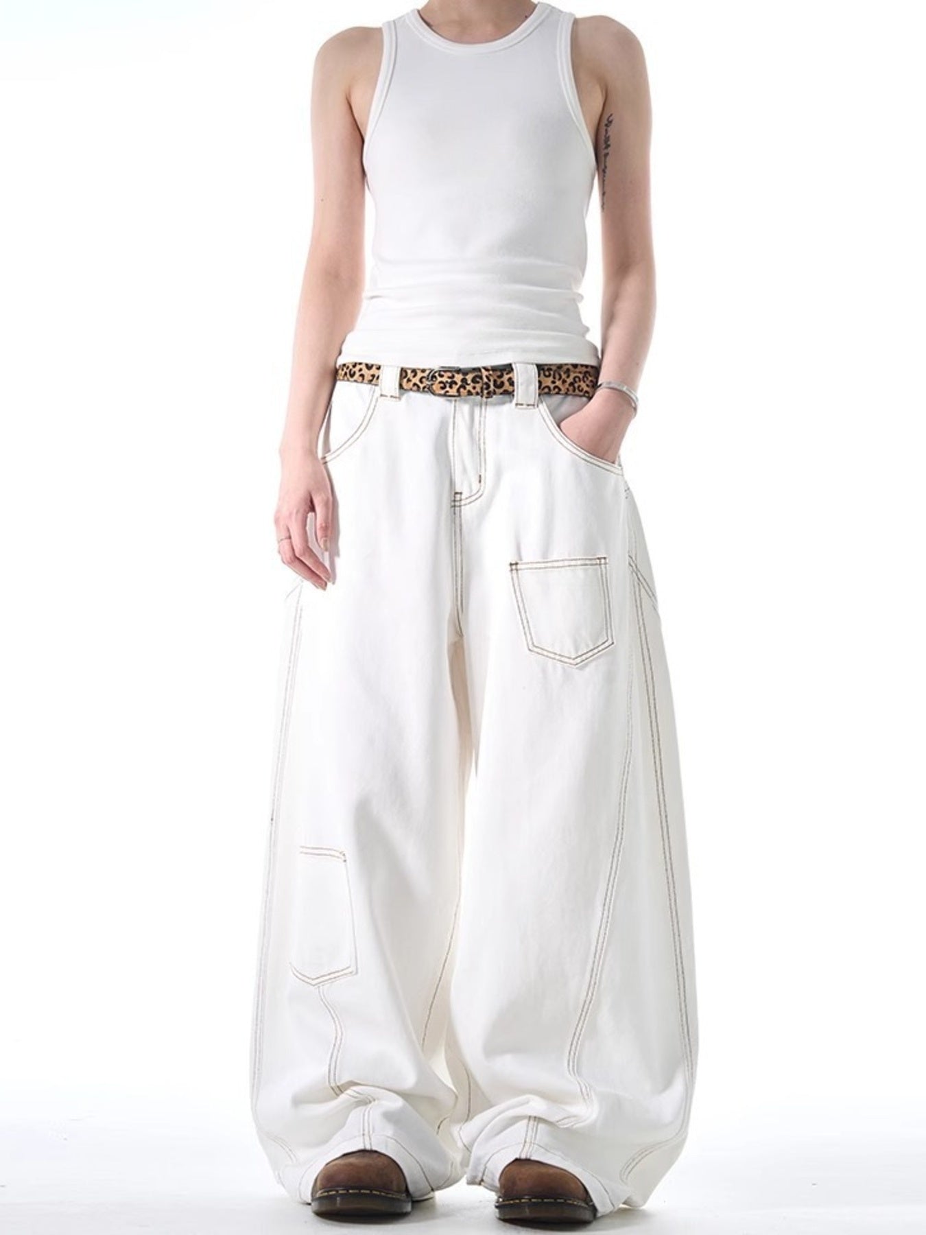 White cotton wide-leg jeans with contrast stitching and functional pockets.