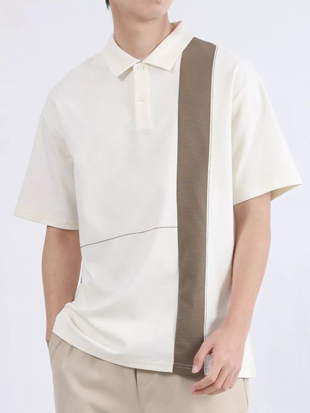 Men's cream polo with brown color block stripe and subtle horizontal line detail.