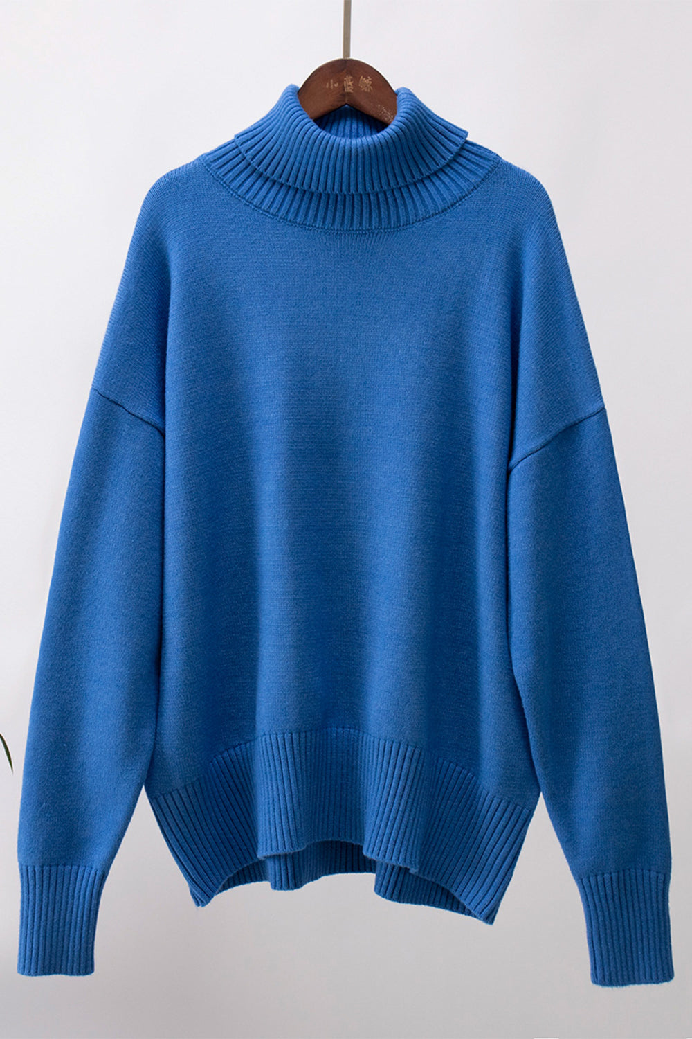 Royal Blue relaxed fit knit sweater with a roll neck and ribbed cuffs and hem.