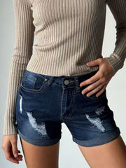 Dark blue distressed denim shorts with cuffed hem and button closure.