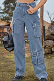 Light wash denim cargo pants with relaxed wide leg and multiple utility pockets.