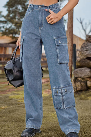 Light wash denim cargo pants with relaxed wide leg and multiple utility pockets.