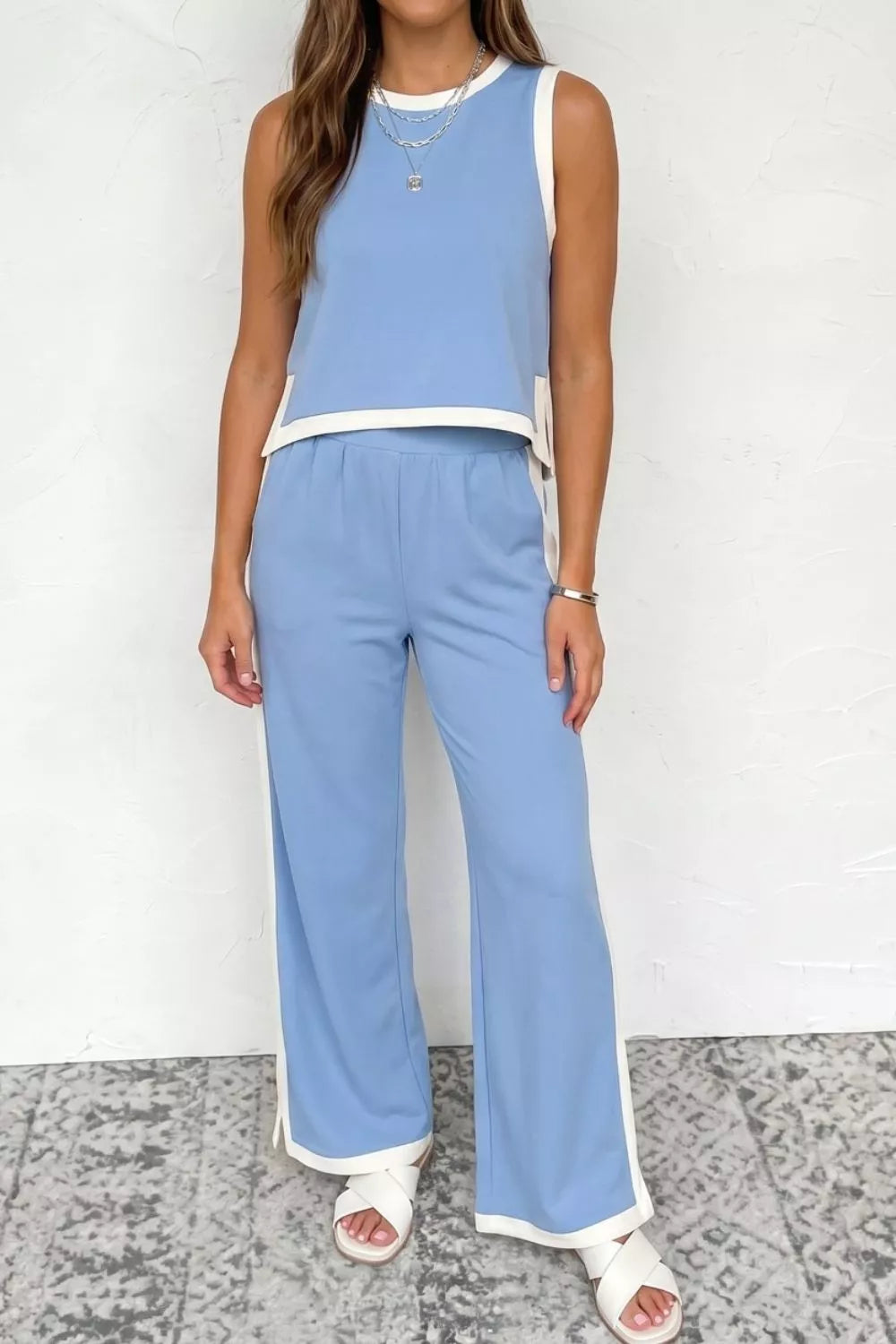 Light blue colorblock crop top and wide leg pants set with white trim.