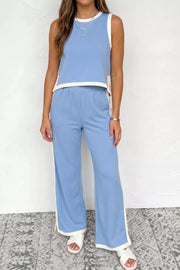 Light blue colorblock crop top and wide leg pants set with white trim.
