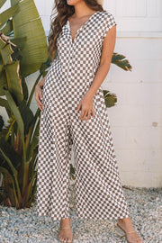 Checkered palazzo jumpsuit in mocha with cap sleeves and buttoned V-neck.