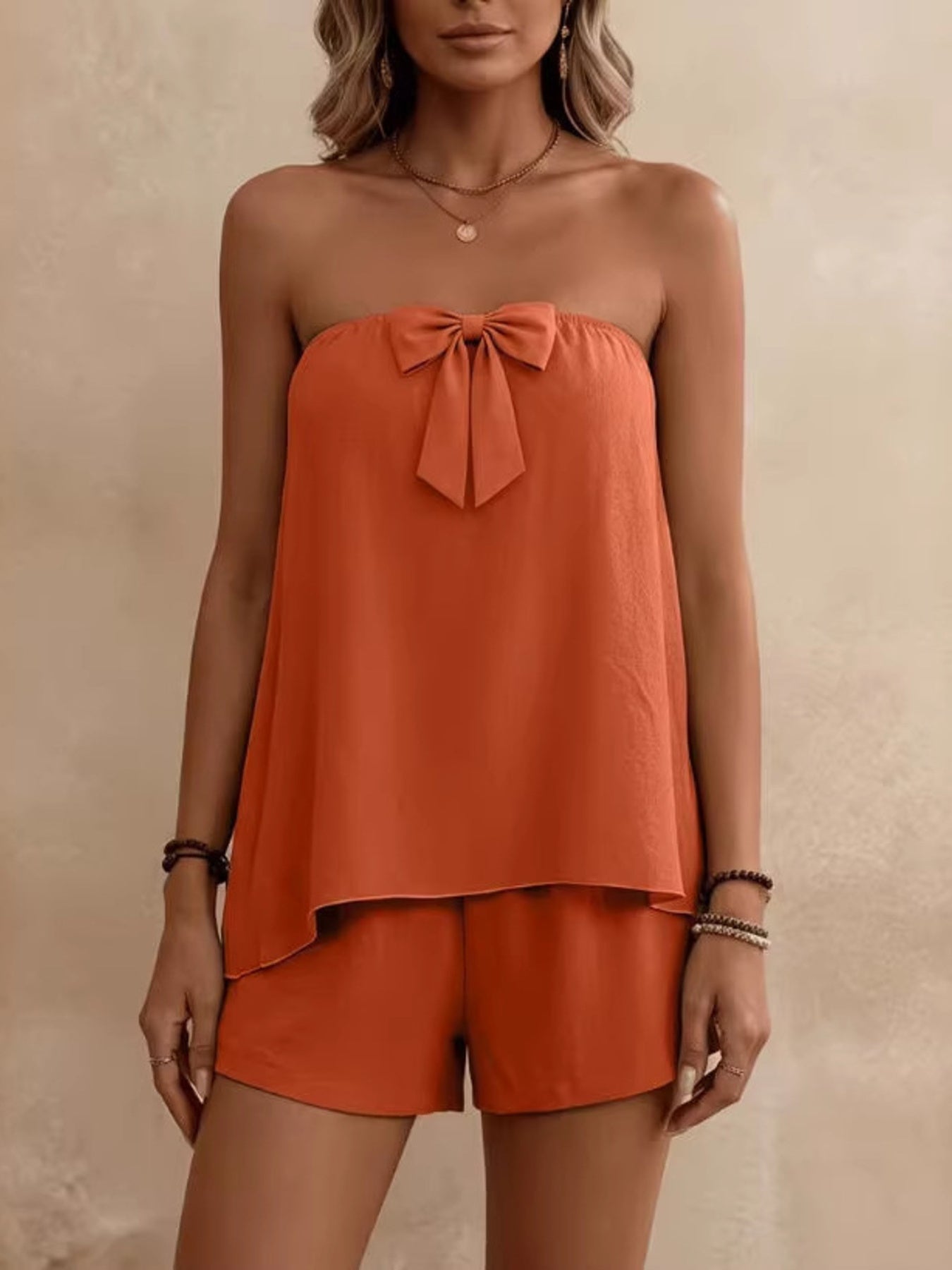Orange bowknot tube top and shorts set with a relaxed fit.