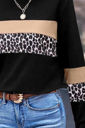 Colorblock leopard panel tee in black with tan and leopard print accents.