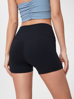 Black Nova Rise high-motion shorts with V-seam detail.