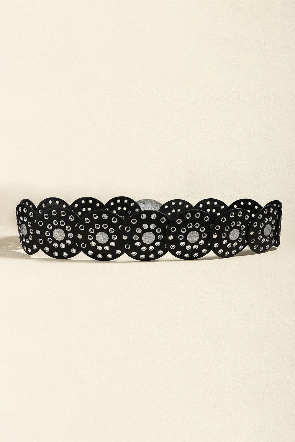 Black statement belt with silver disc embellishments and eyelet details.