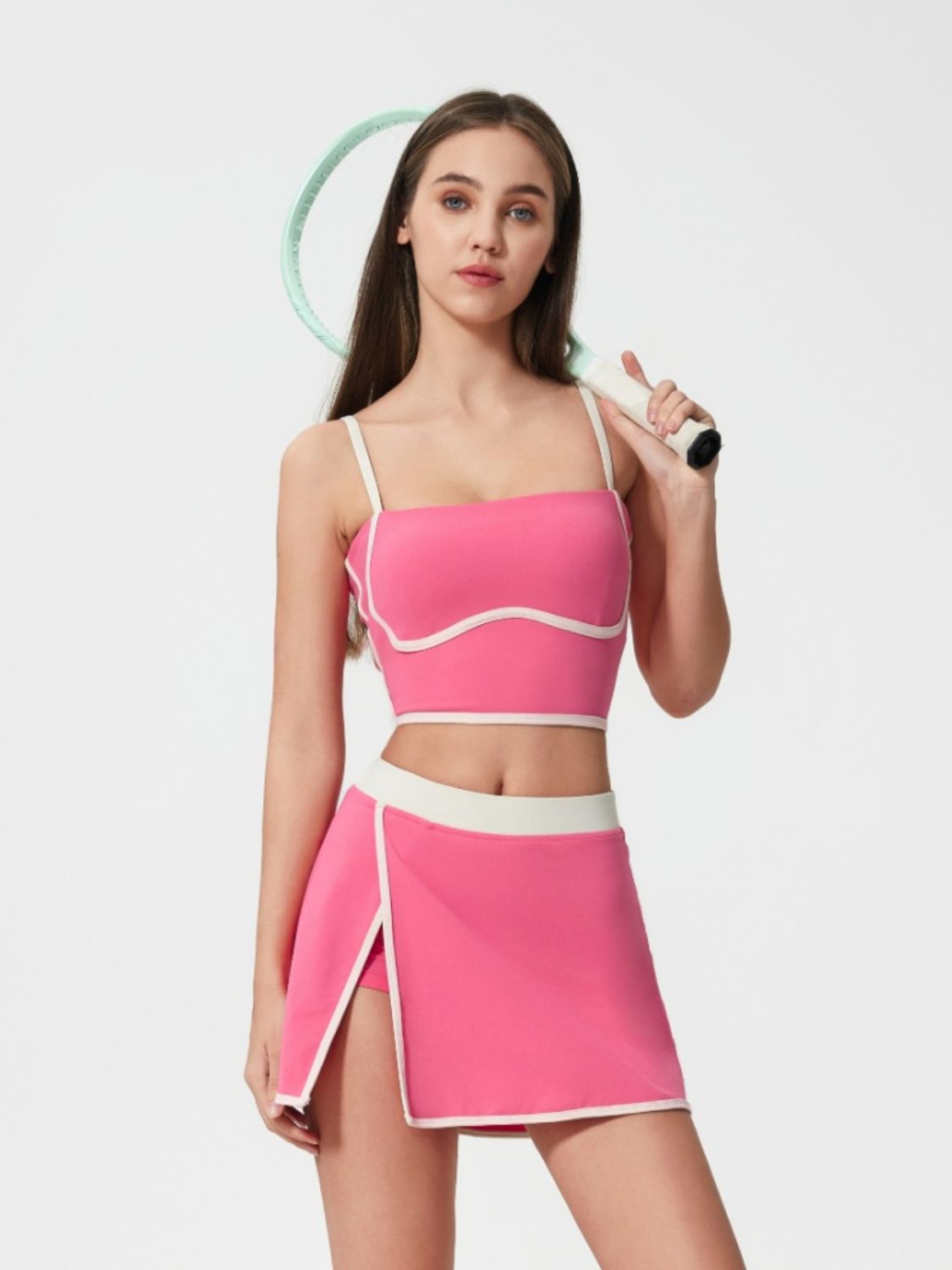 Fuchsia pink contour-trimmed crop top with white piping and white straps.
