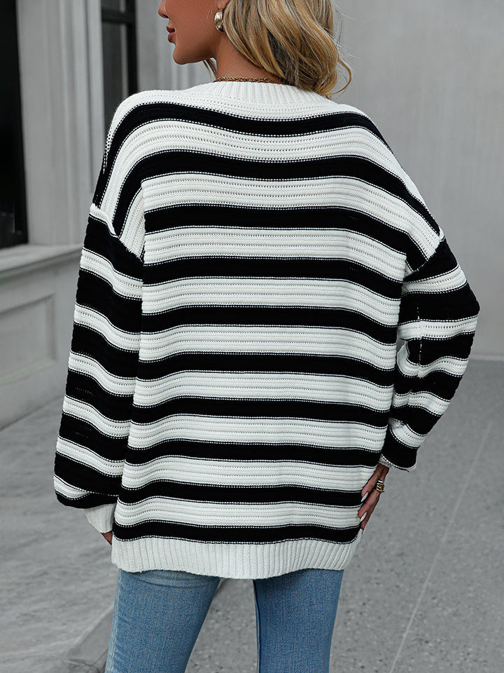Chunky stripe relaxed fit knit sweater in black and white acrylic, crew neck, long sleeves.