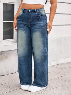 Plus size vintage-inspired wide leg jeans in blue denim with faded details.