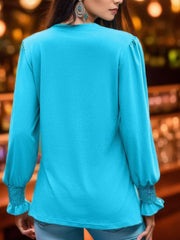 Sky blue long sleeve blouse with pleated yoke and gathered cuffs