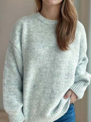 Oversized crewneck sweater in light blue marled knit with ribbed cuffs and hem