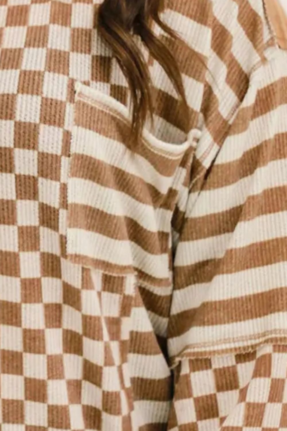 Split-panel waffle knit top in brown with checkerboard and stripe patterns, featuring a chest pocket.