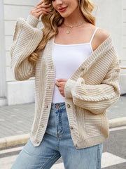Cable Knit Button-up Cardigan in Black, model styling view