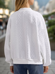White bomber jacket with textured cable knit and ribbed cuffs and hem.