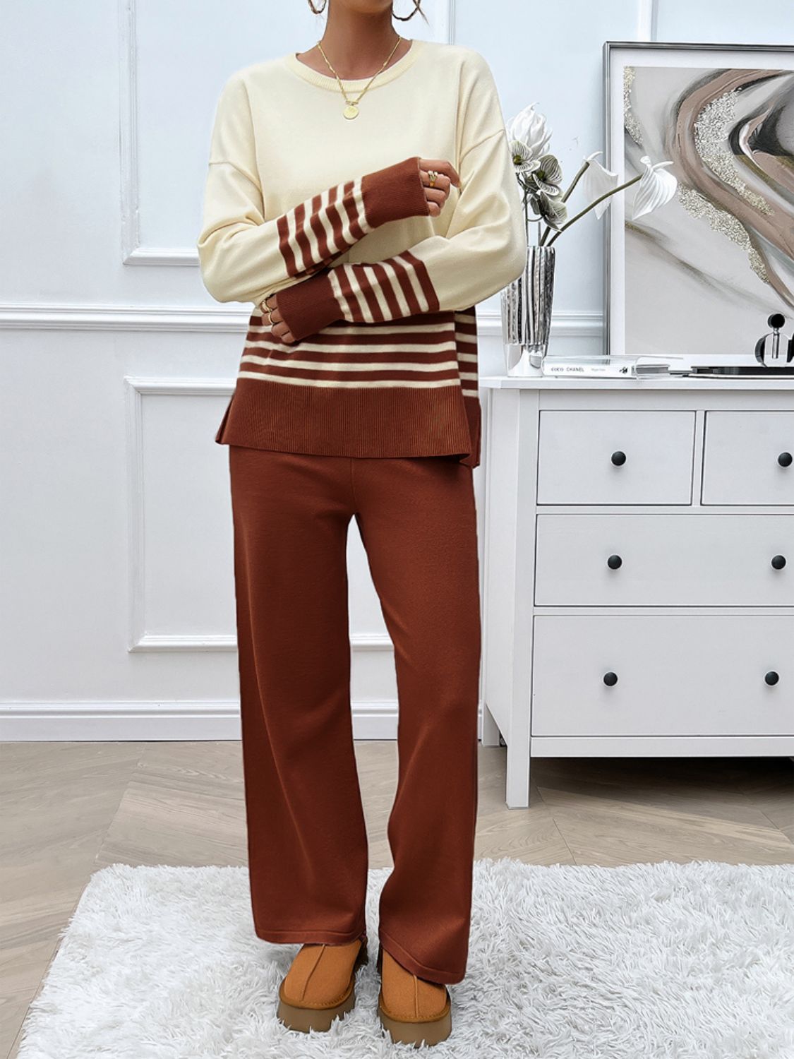Color-blocked knit lounge set with cream top and brown striped sleeves and hem, paired with brown wide-leg pants.
