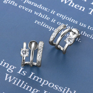 Silver triple-bar crystal stud earrings with D color grade stones.