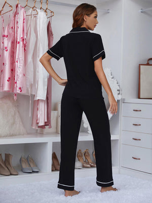 Black piped trim lounge set with short sleeve top and pants.
