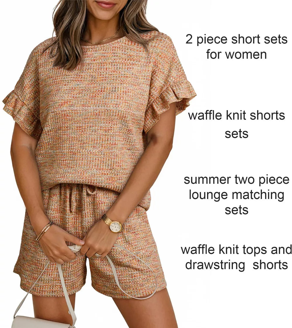 Orange-red waffle knit two-piece set with ruffled sleeves and drawstring shorts.