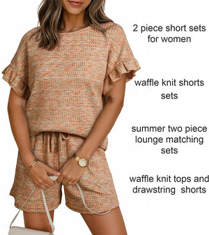 Orange-red waffle knit two-piece set with ruffled sleeves and drawstring shorts.