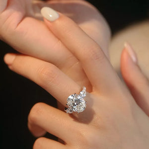 Dazzling Moissanite oval ring in sterling silver with brilliant side stones