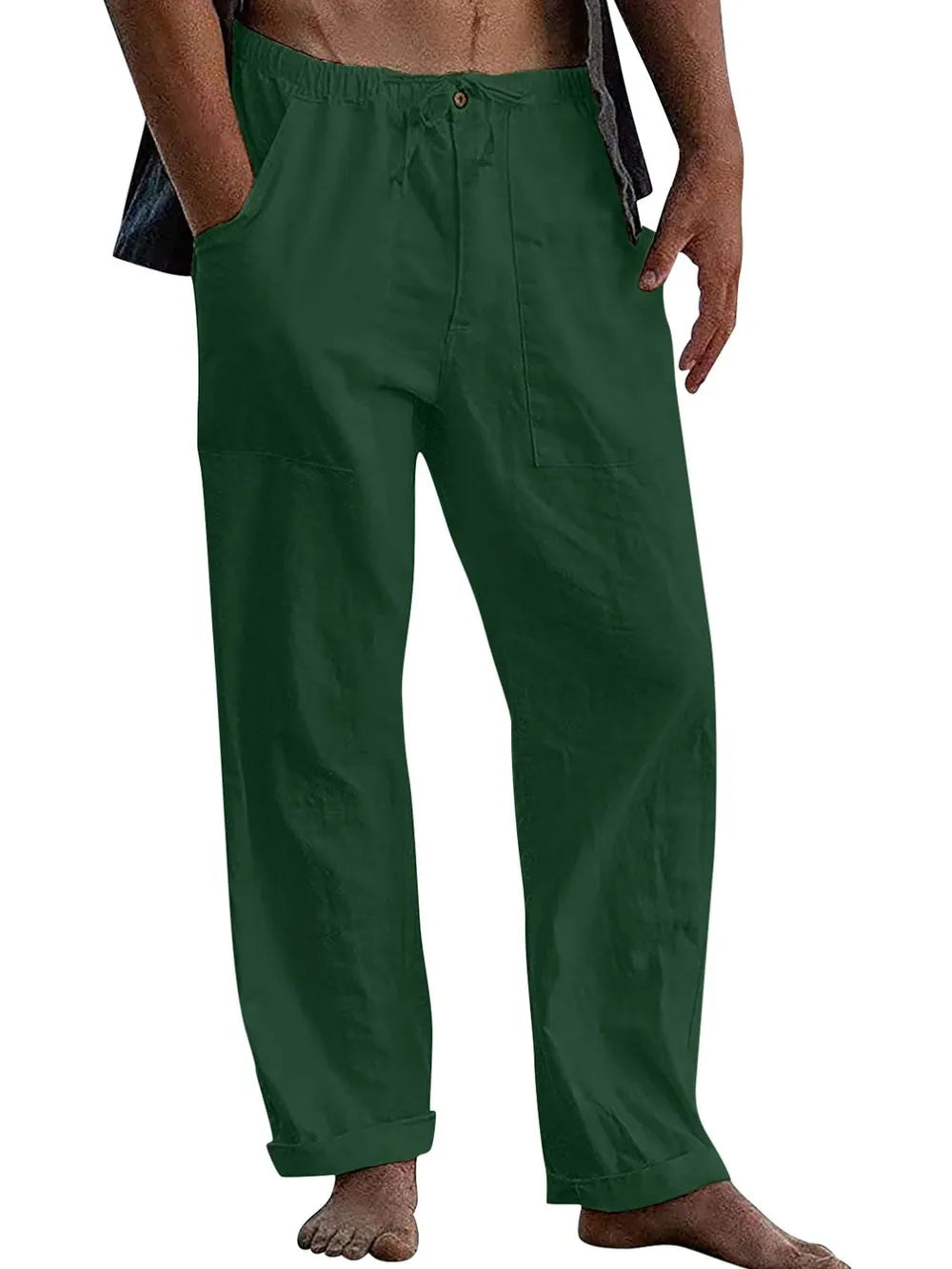 Relaxed fit linen drawstring trousers in dark green with cuffed hems and pockets.