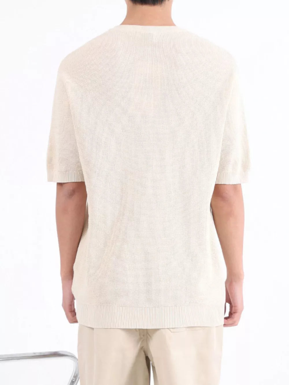 Men's Apricot textured knit short sleeve henley undershirt with ribbed hem.