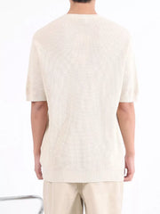 Men's Apricot textured knit short sleeve henley undershirt with ribbed hem.