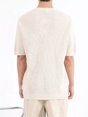 Men's Apricot textured knit short sleeve henley undershirt with ribbed hem.